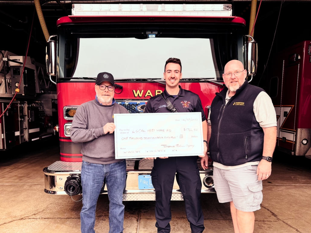 Tombstone Trading Company presents check to the Ware Local 1851 Firefighter's Union