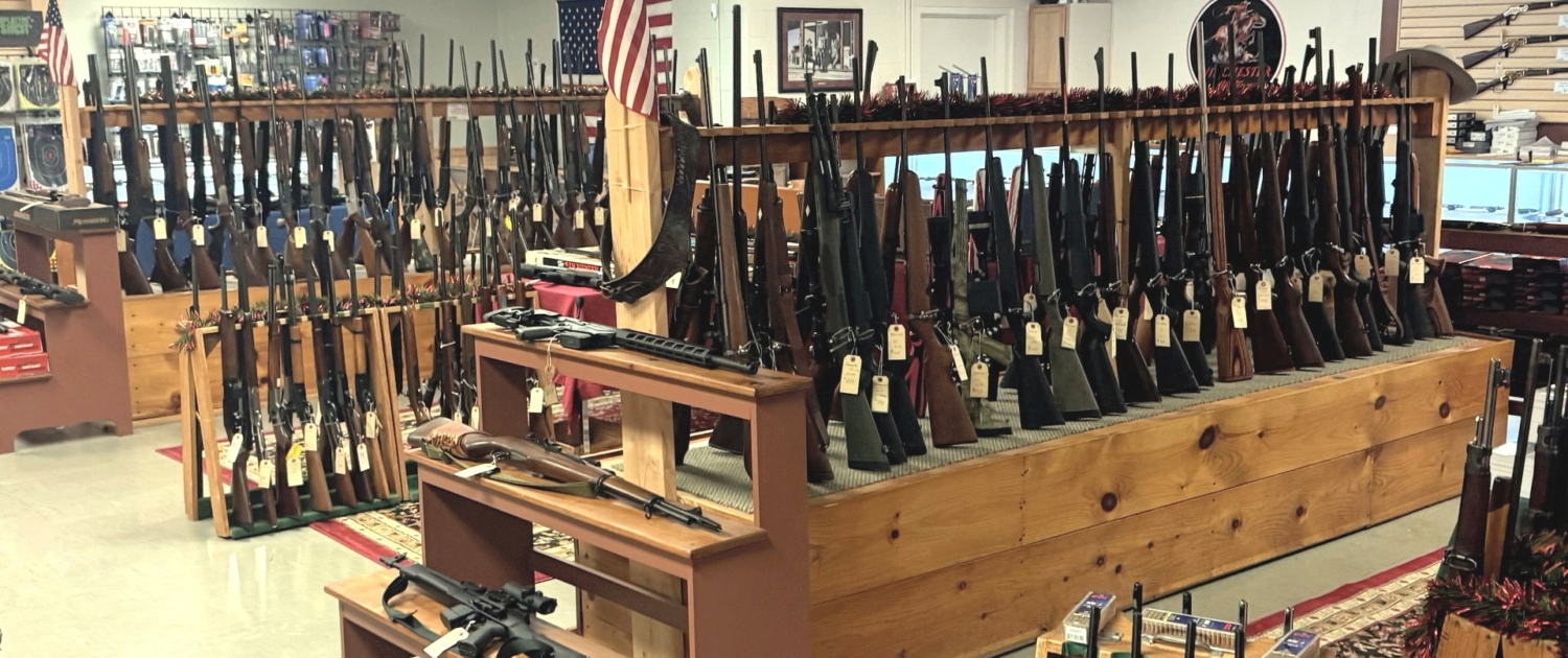 rifle-racks-hero-FINAL racks full of quality used guns at Tombstone Trading Company's Ware, MA showroom
